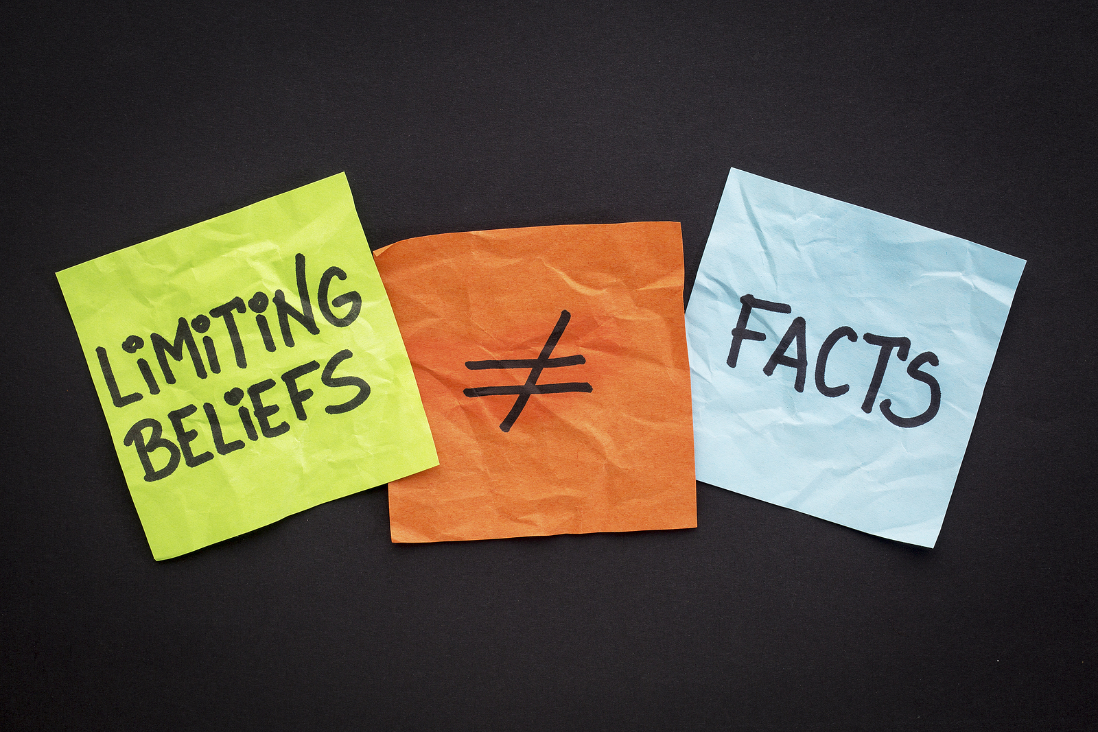 limiting beliefs are not facts concept – handwriting on sticky n